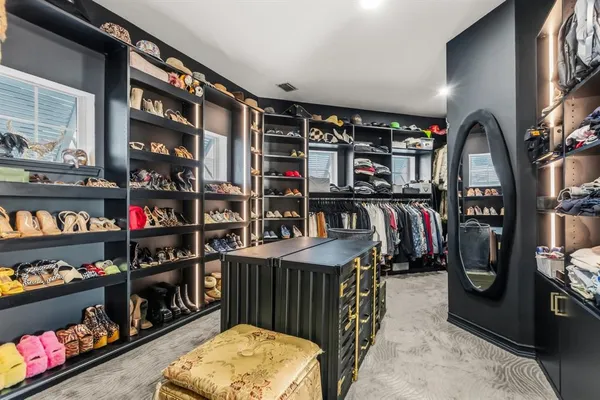 a bedroom with a bed window and a couch