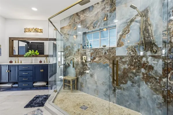 a view of a swimming pool with a table and chairs