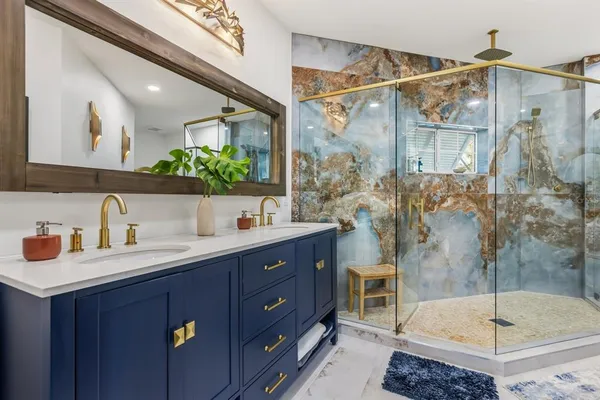 a view of a house with swimming pool and sitting area