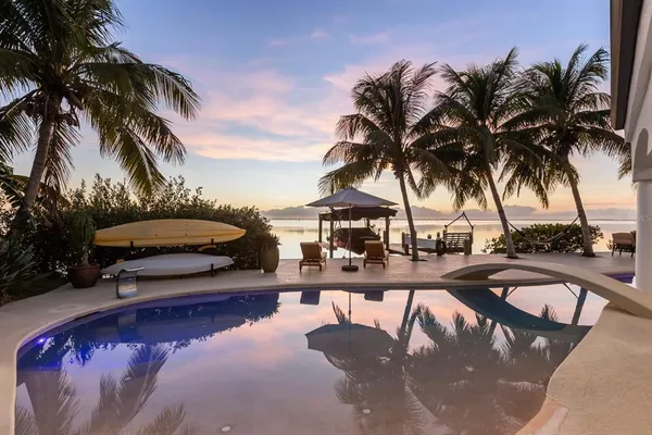 a view of a chairs and table in patio