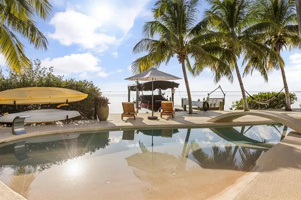 a bedroom with a bed and a tv