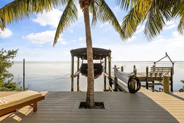 a view of a swimming pool with lounge chair