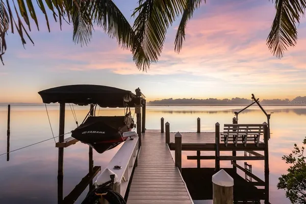 a front view of house with yard and swimming pool
