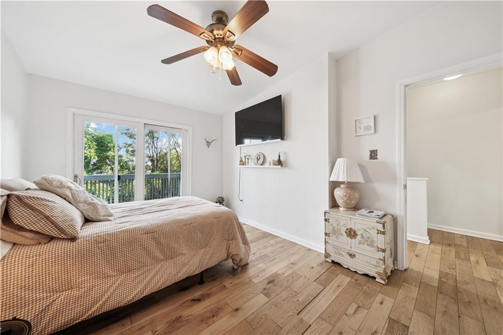 154 Henderson Street Pittsburgh, PA 15212 - Photo 15 of 31 a bedroom with a bed and a television