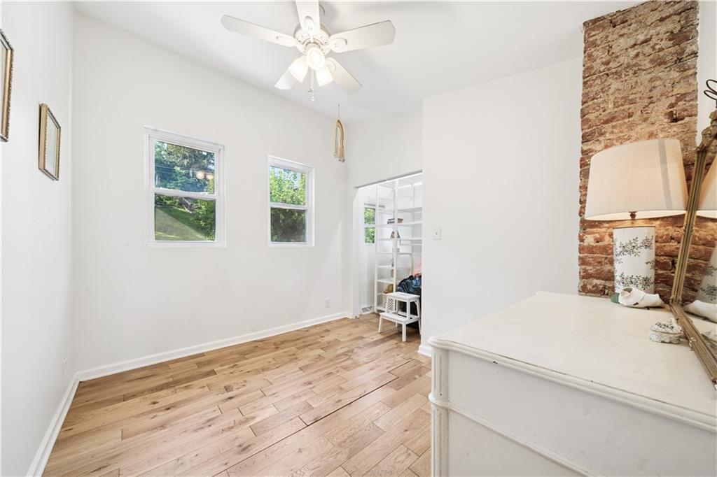 154 Henderson Street Pittsburgh, PA 15212 - Photo 19 of 31 view of a bedroom with a bed and a chandelier