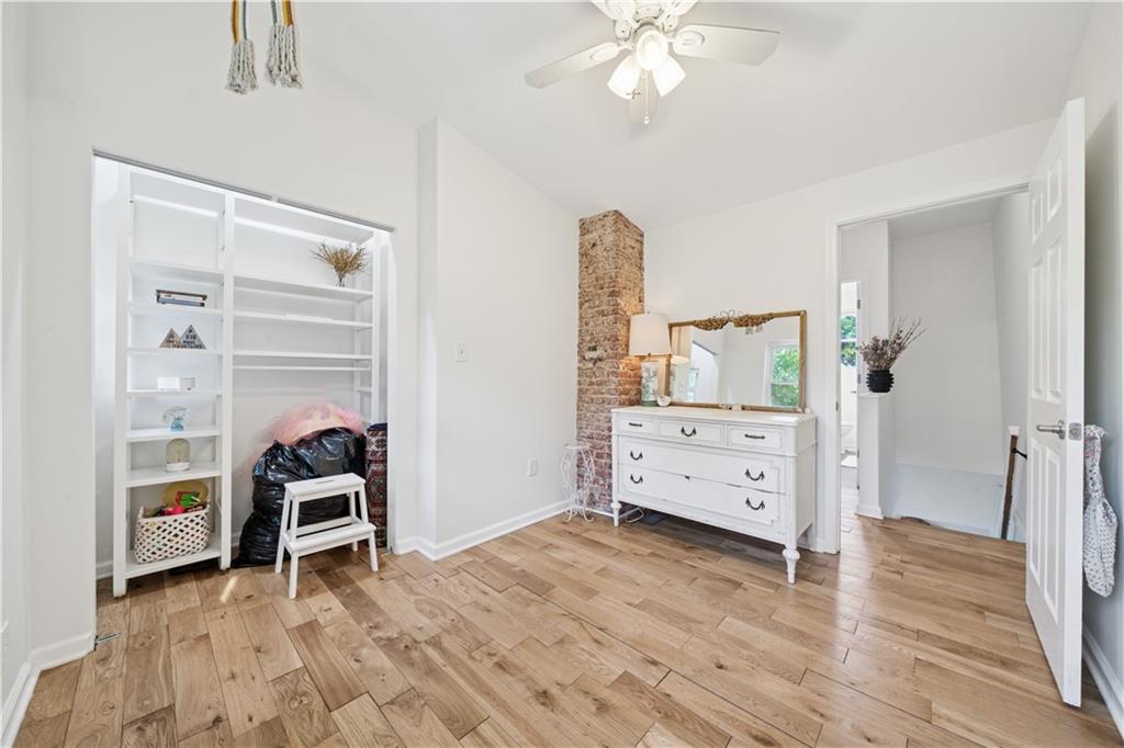 154 Henderson Street Pittsburgh, PA 15212 - Photo 20 of 31 a view of a bedroom with furniture and wooden floor