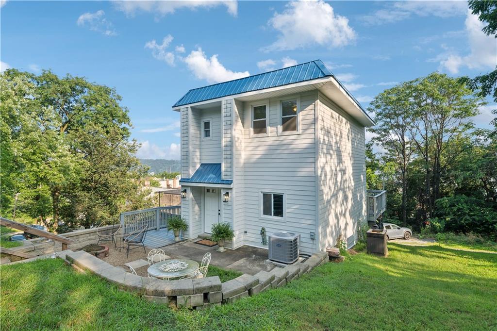 154 Henderson Street Pittsburgh, PA 15212 - Photo 2 of 31 a backyard of a house with garden and outdoor seating