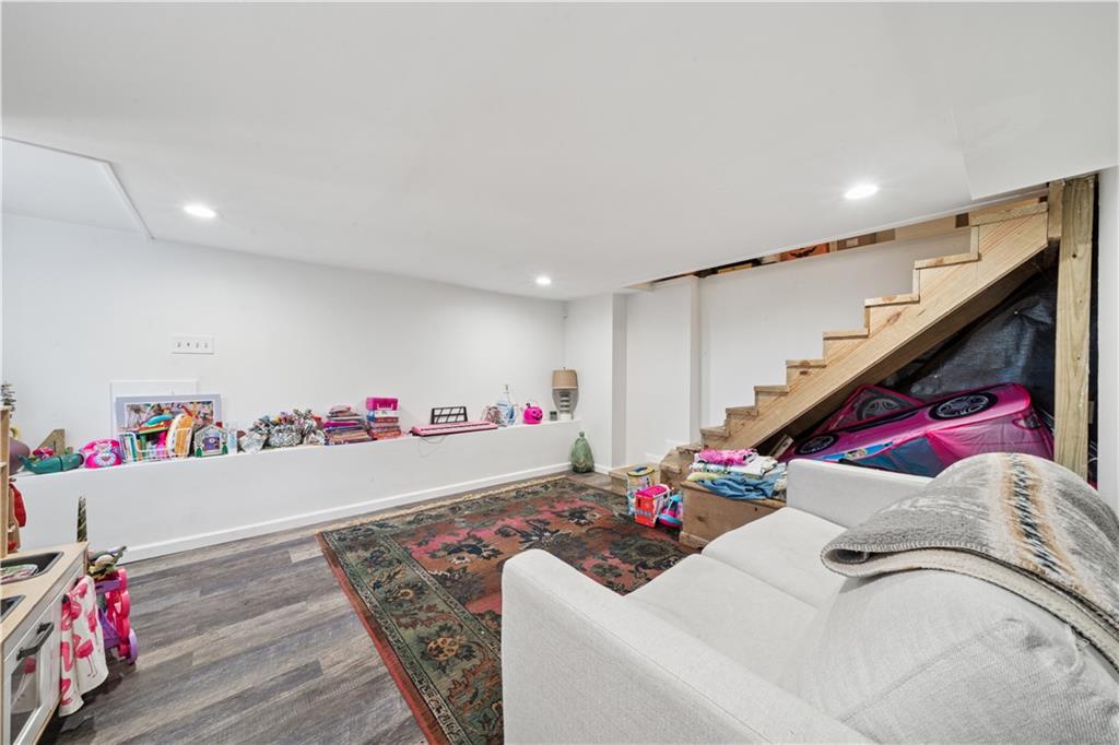 154 Henderson Street Pittsburgh, PA 15212 - Photo 24 of 31 a room with furniture and a wooden floor