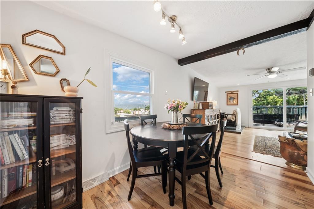 154 Henderson Street Pittsburgh, PA 15212 - Photo 5 of 31 a view of a dining room with furniture and a floor to ceiling window