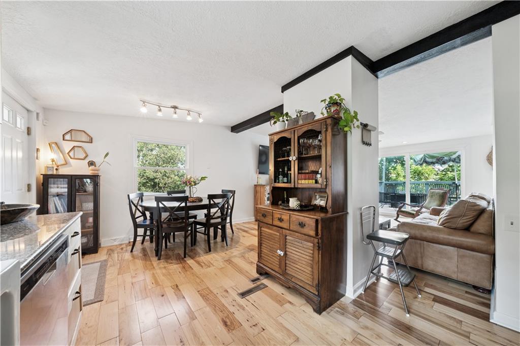 154 Henderson Street Pittsburgh, PA 15212 - Photo 6 of 31 a living room with furniture and a large window