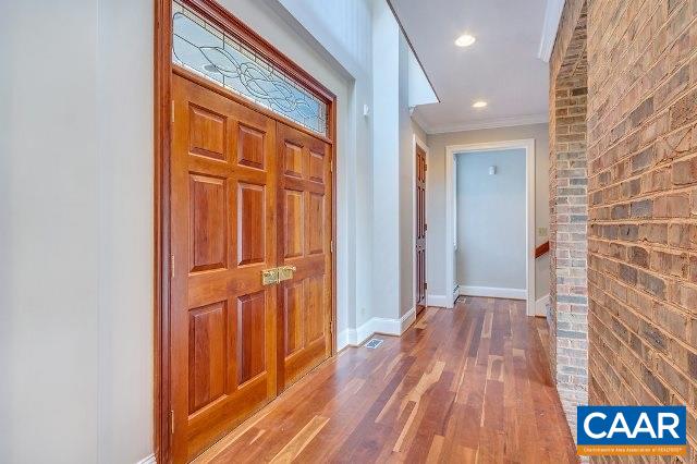 3690 Free Union Road Charlottesville, VA 22901 - Photo 5 of 41 a view of a hallway with wooden floor and staircase