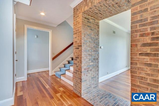 3690 Free Union Road Charlottesville, VA 22901 - Photo 6 of 41 a view of a hallway with wooden floor and staircase