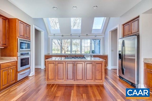 3690 Free Union Road Charlottesville, VA 22901 - Photo 10 of 41 a view of a kitchen with stainless steel appliances granite countertop a refrigerator a stove and a wooden floors