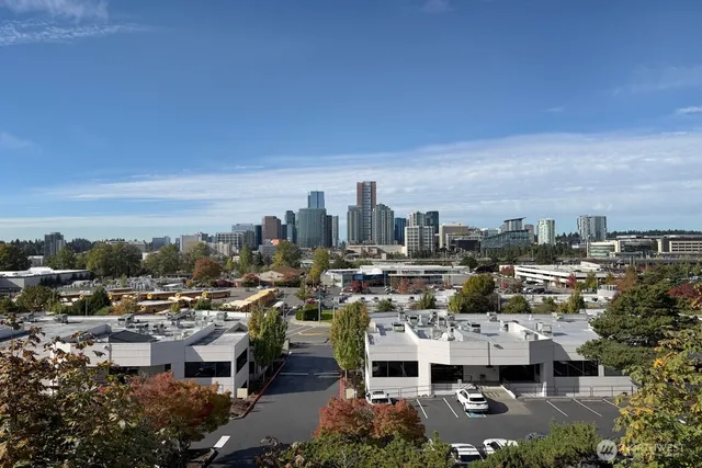 a view of a house with wooden fence