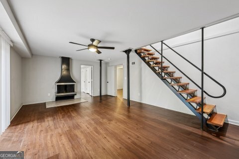 2562 Farley Street East Point, GA 30344 - Photo 19 of 30 a view of an entryway with wooden floor and stairs