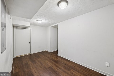 2562 Farley Street East Point, GA 30344 - Photo 21 of 30 an empty room with wooden floor