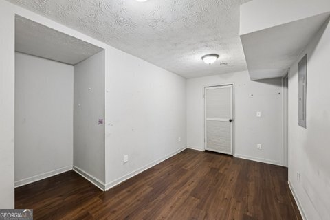 2562 Farley Street East Point, GA 30344 - Photo 22 of 30 a view of an empty room with wooden floor