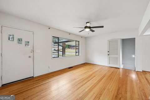 2562 Farley Street East Point, GA 30344 - Photo 4 of 30 a view of an empty room with wooden floor
