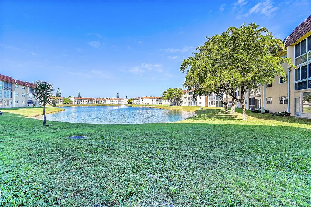 2811 North Pine Island Road, Unit 111 Sunrise, FL 33322 - Photo 13 of 13 a view of a park with large trees