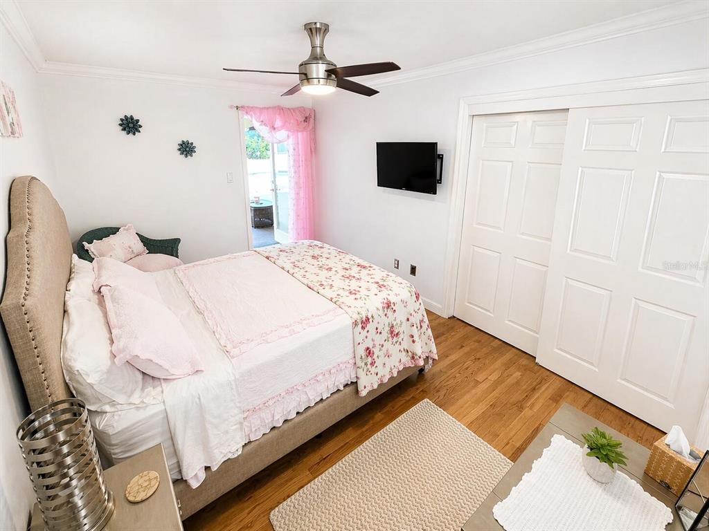 2313 Southeast 7th Street Ocala, FL 34471 - Photo 24 of 54 a spacious bedroom with a bed and a flat screen tv