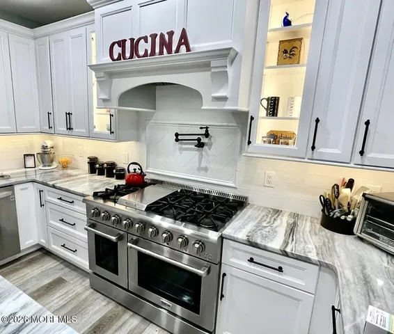 a bed room with a bed and a television