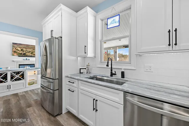 a bed room with a bed and a ceiling fan