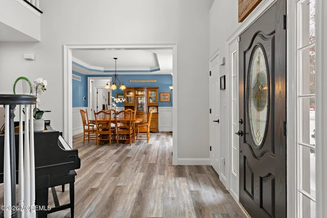 a view of a house with swimming pool and sitting area