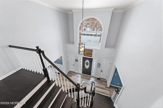 a view of a white house with a yard