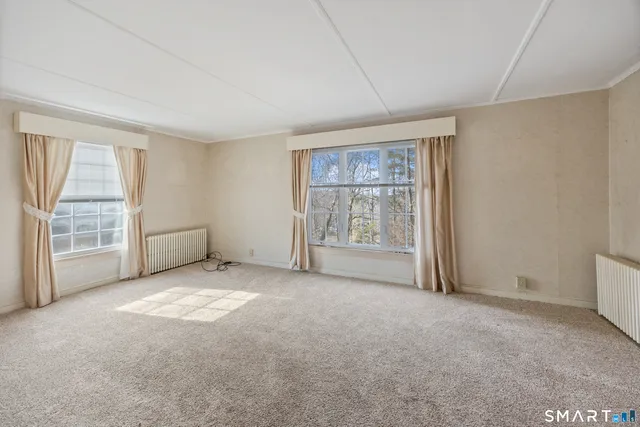 an empty room with windows