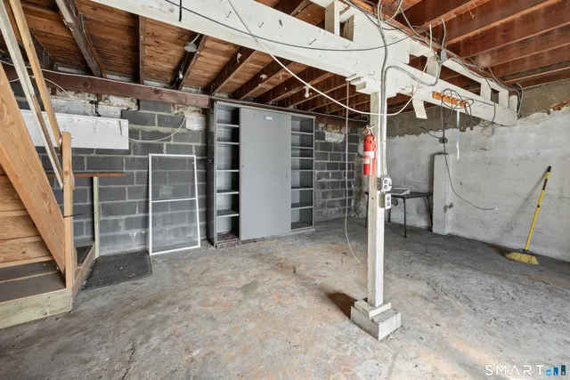 a view of empty room with white walls