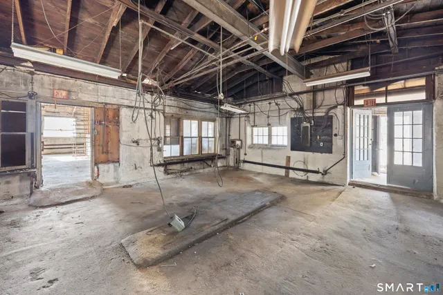 a view of a room with wooden ceiling