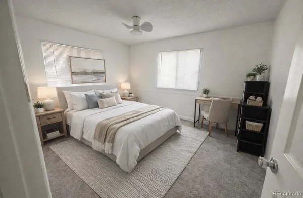 a bedroom with a bed and a tv