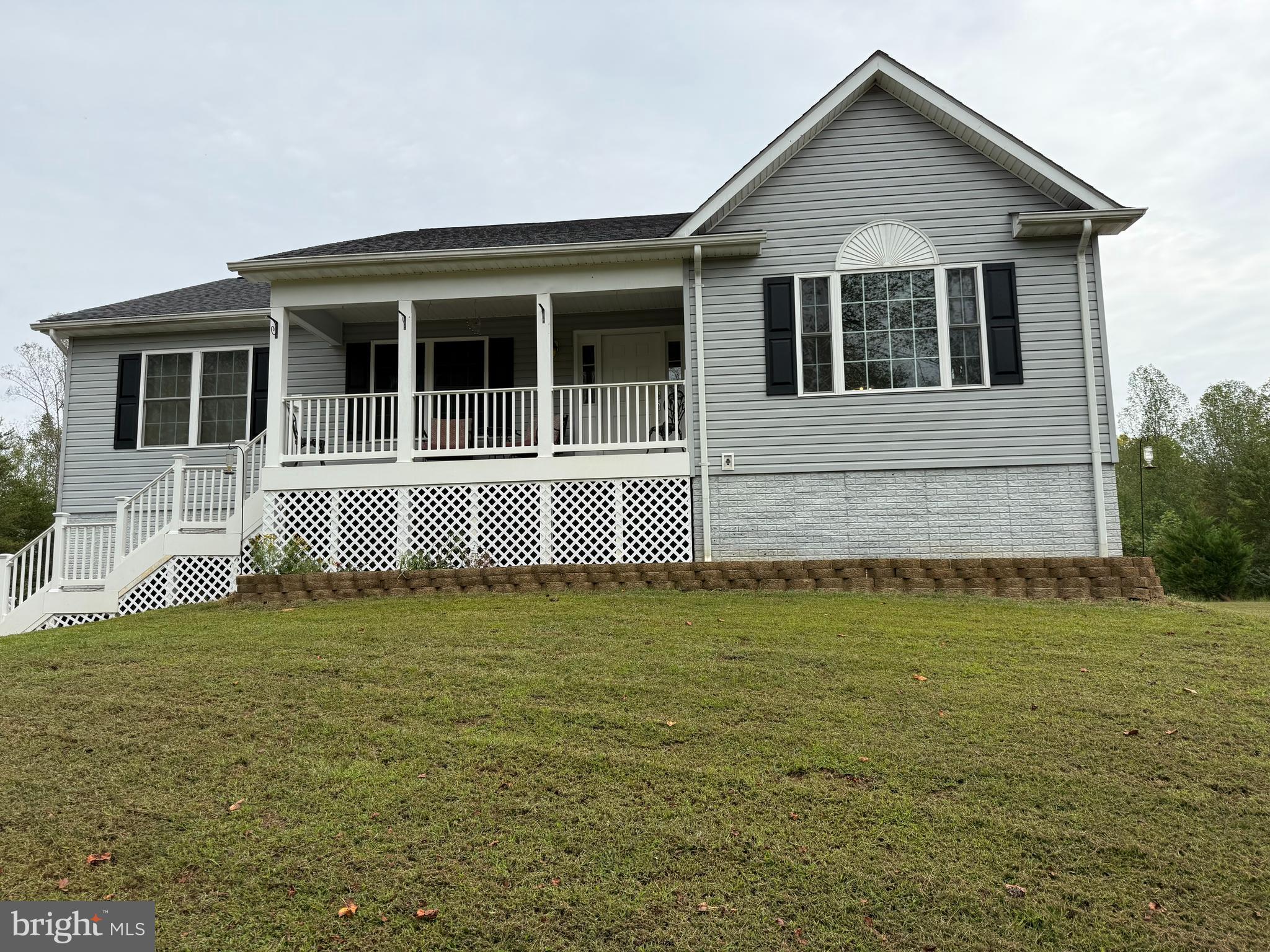 21281 Old Mill Road Culpeper, VA 22701 - Photo 2 of 40 a front view of a house with a garden