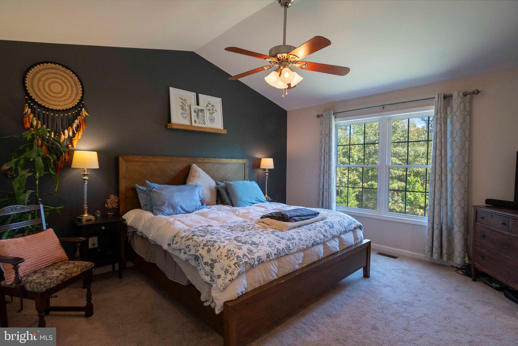 21281 Old Mill Road Culpeper, VA 22701 - Photo 31 of 40 a bedroom with a bed and a chandelier