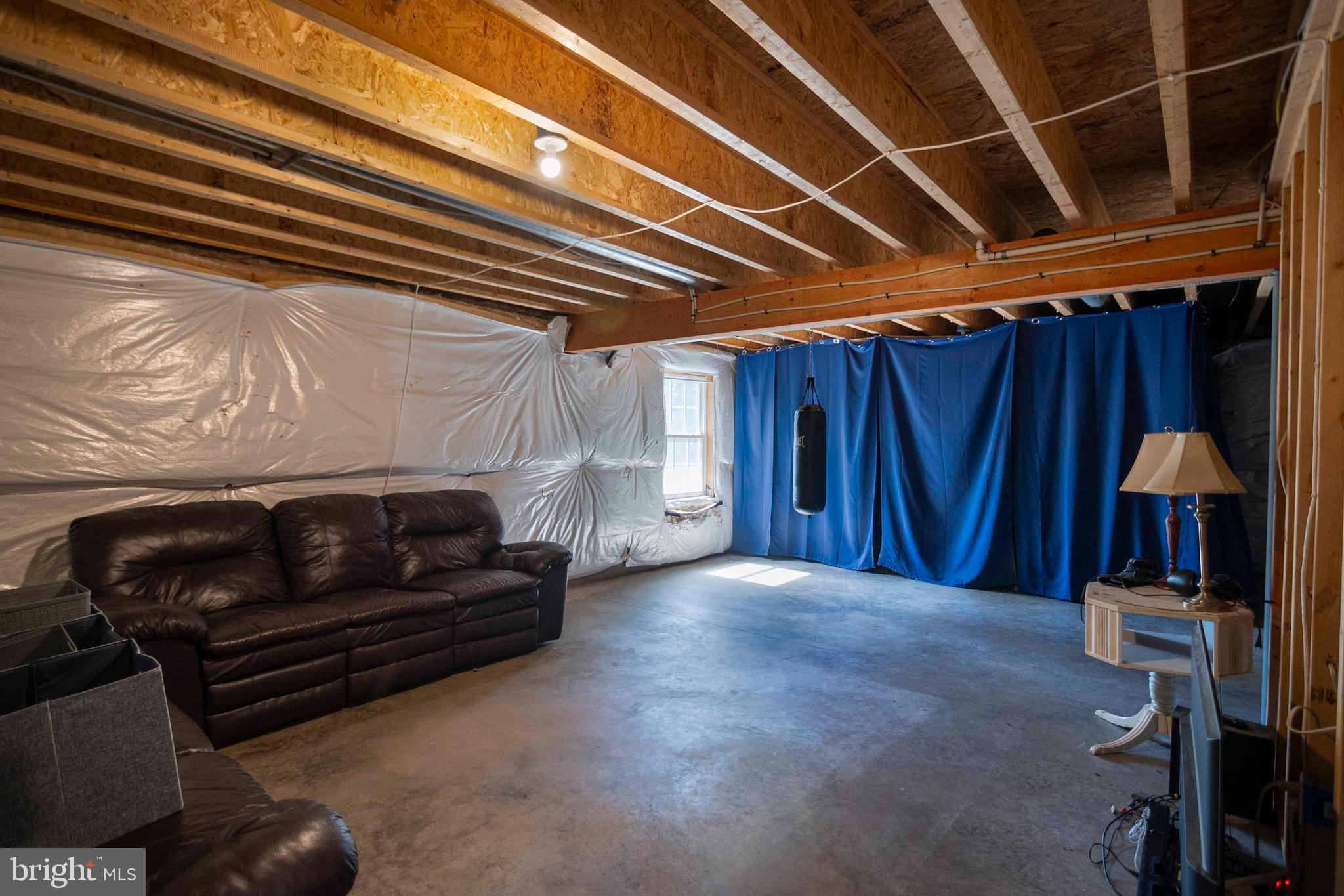 21281 Old Mill Road Culpeper, VA 22701 - Photo 38 of 40 a bedroom with a bed and a chair