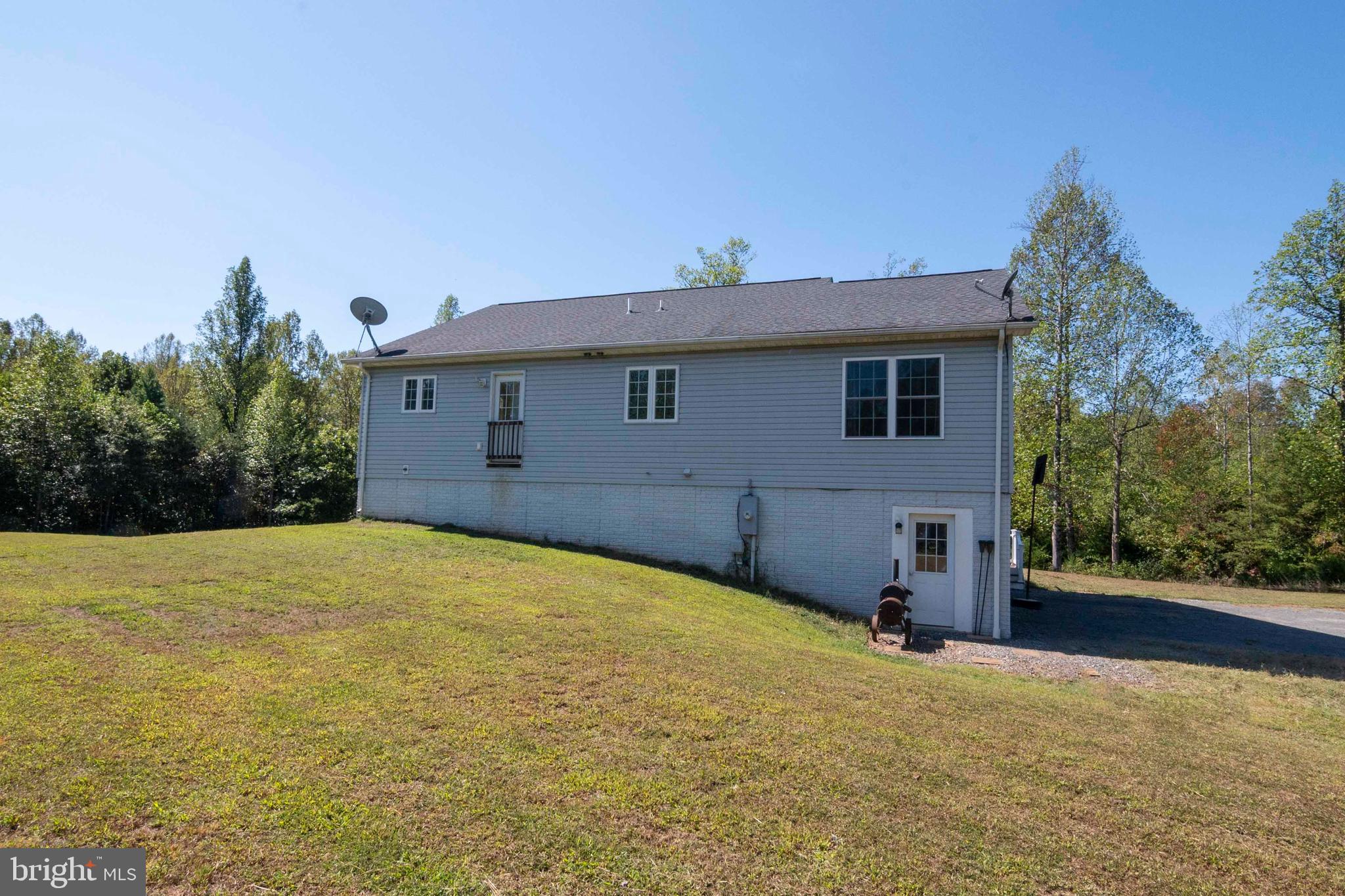 21281 Old Mill Road Culpeper, VA 22701 - Photo 5 of 40 a view of a house with a backyard
