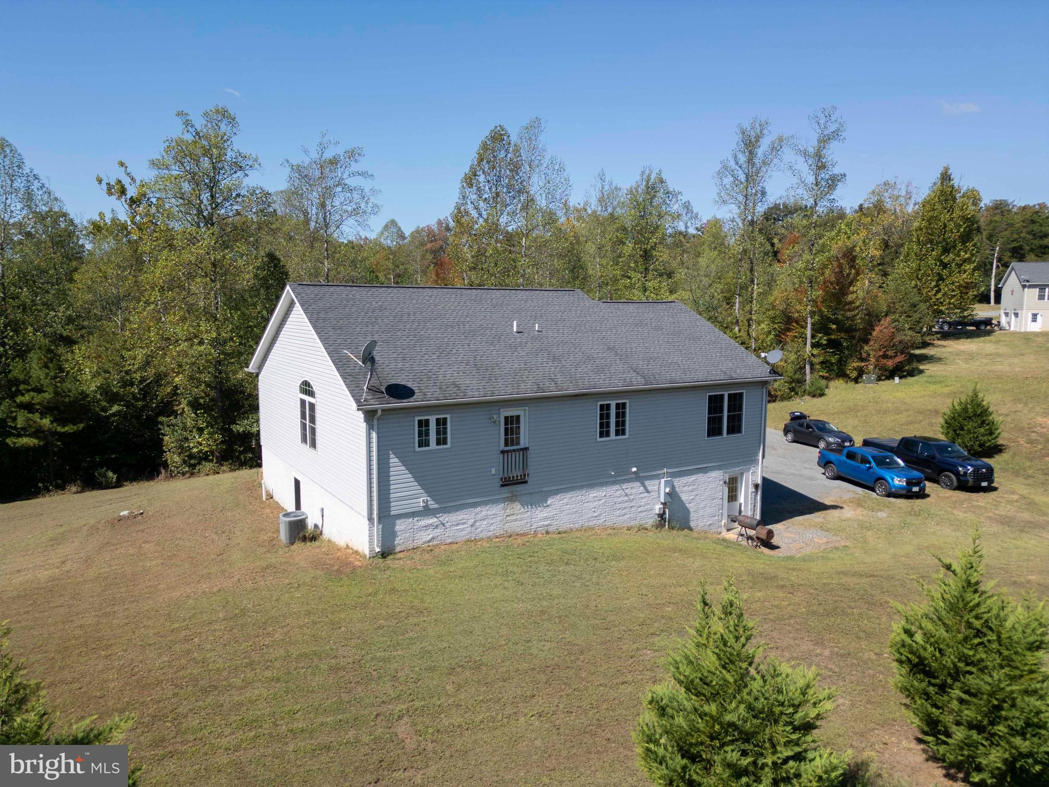 21281 Old Mill Road Culpeper, VA 22701 - Photo 9 of 40 a view of a house with a backyard and trees