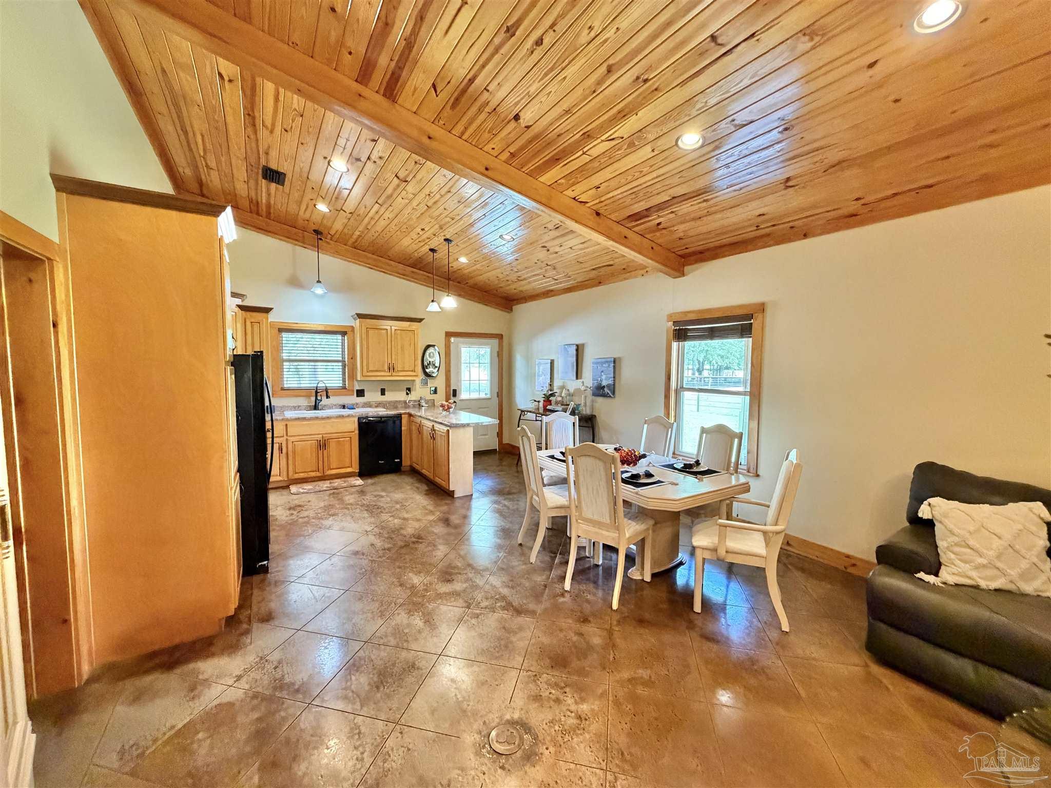 145 Tower Road Uriah, AL 36480 - Photo 7 of 72 a view of a dining room with furniture and a chandelier