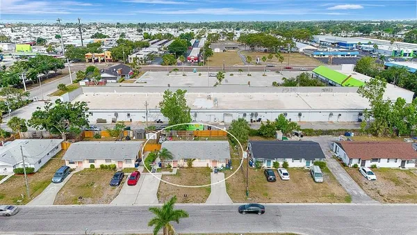 an aerial view of residential houses with outdoor space