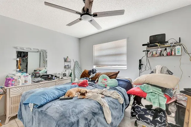 a bed room with bed and a window