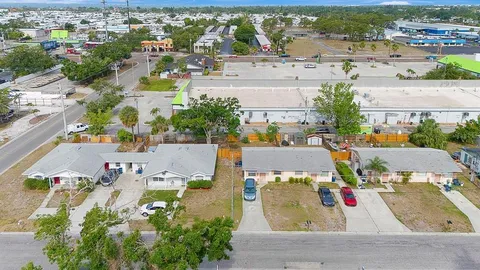 an aerial view of residential houses with outdoor space