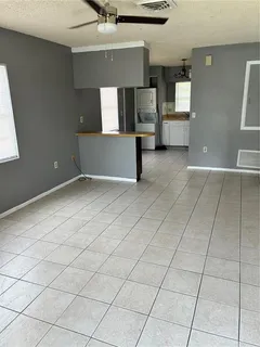 a view of a kitchen with furniture and a window
