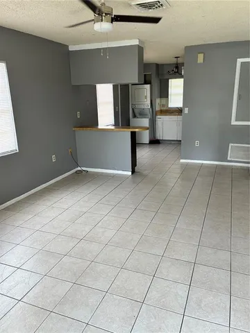 a view of a kitchen with furniture and a window