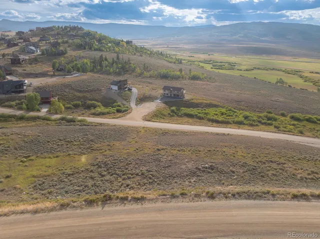 a view of a town with mountains in the background