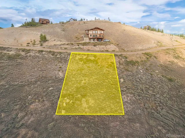 a view of a big house with a mountain view