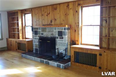 1371 Ackermanville Road Bangor, PA 18013 - Photo 5 of 29 Beautiful spacious living/dining room with built in shelves and stone fireplace