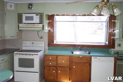 1371 Ackermanville Road Bangor, PA 18013 - Photo 7 of 29 Open kitchen with window box. Updated ceramic cooktop, microwave and dishwasher