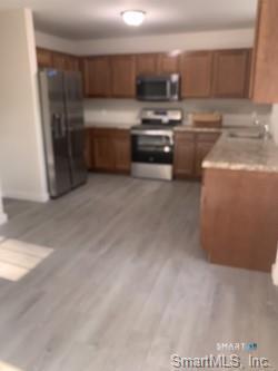 64 Boardman Road New Milford, CT 06776 - Photo 3 of 8 a kitchen with kitchen island a sink and a stove top oven