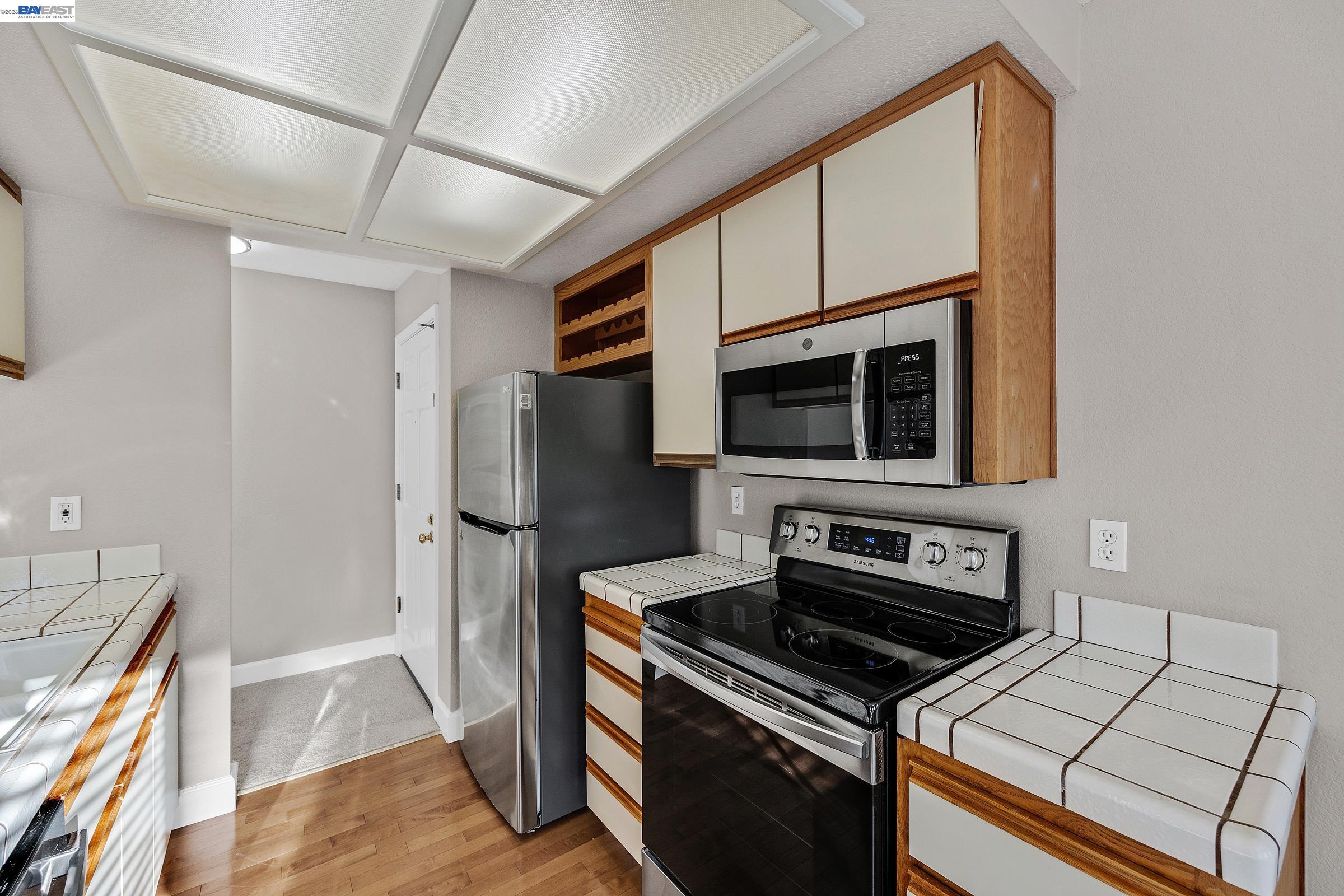 3769 Crow Canyon Road San Ramon, CA 94582 - Photo 21 of 56 a kitchen with a stove and a microwave