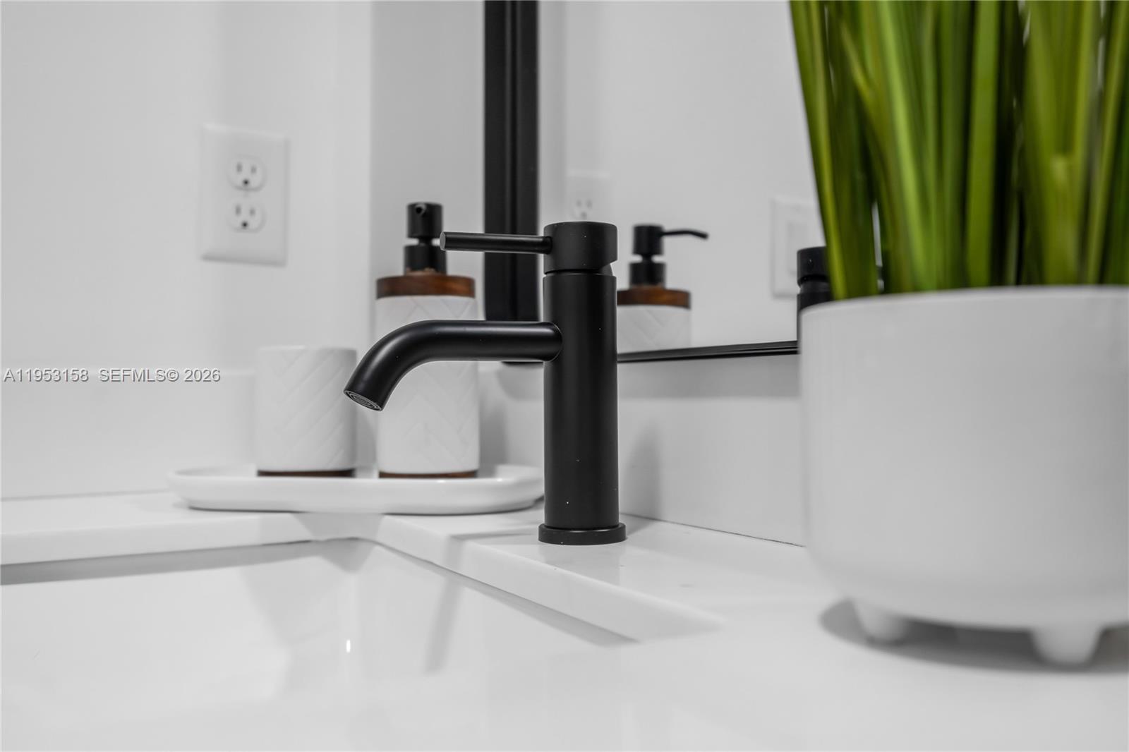 3728 Northwest 19th Avenue, Unit 304 Miami, FL 33142 - Photo 19 of 26 a bathroom with a sink